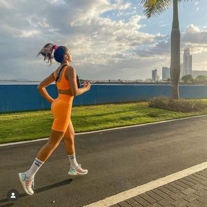 Alo neon apricot bike shorts